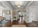 Inviting foyer with hardwood floors, tray ceilings, and an open layout seamlessly connecting to the living spaces at 615 Welker St, Charlotte, NC 28204