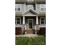 Inviting front porch with stone accents, fresh landscaping, and stylish details creates a welcoming entrance at 615 Welker St, Charlotte, NC 28204