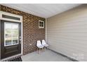 Cozy front porch with seating, perfect for relaxing outdoors at 7004 Everly Commons Ln, Tega Cay, SC 29708