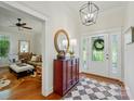 Bright foyer with hardwood floors, decorative rug, and decorative front door at 725 Bradshaw Rd, Mt Ulla, NC 28125