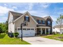 Lovely home featuring a 2 car garage, basketball hoop, and a manicured lawn at 7412 Greene Mill Sw Ave, Concord, NC 28025