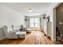Cozy living room with hardwood floors, two chairs, lots of natural light from large window at 1006 Chambers Rd, York, SC 29745
