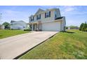 A well manicured lawn leads to the home with an attached garage at 118 Maplecrest Dr, Kings Mountain, NC 28086