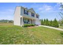 Well-kept home exterior with a lush green lawn and mature landscaping at 118 Maplecrest Dr, Kings Mountain, NC 28086