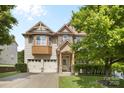 Charming two-story home featuring stone accents, well-manicured lawn, and attached two-car garage at 12604 Congregation Dr, Charlotte, NC 28278