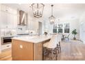 Bright, spacious kitchen with island, modern appliances, and stylish pendant lighting at 131 High Lake Dr, Statesville, NC 28677