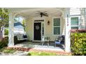 Inviting front porch features a swing, seating, and a welcoming entryway with stylish decor at 1424 South St, Cornelius, NC 28031
