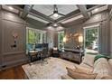 Elegant home office with coffered ceilings, custom shelving, and large windows at 2841 Attaberry Dr, Charlotte, NC 28205