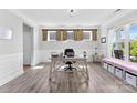 Comfortable home office with natural light, barn door window accents, and light wood flooring at 2936 Shumard Dr, Gastonia, NC 28054