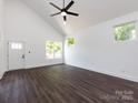 Open living room with high ceilings, lots of natural light, and sleek ceiling fan at 3007 West Blvd, Charlotte, NC 28208