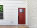 Side door featuring paneled design, contrasting color, and wood deck flooring at 3007 West Blvd, Charlotte, NC 28208