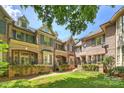 Inviting brick townhomes with manicured lawns, creating beautiful curb appeal at 4020 Barclay Downs Dr, Charlotte, NC 28209