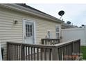 Backyard deck features wooden railing and access to the home's exterior at 428 Lexie Ln # 100, Rock Hill, SC 29732