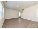 A spacious, brightly lit living room with sleek, modern flooring at 5021 Poplin Vly, Cherryville, NC 28021