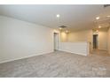 Carpeted bonus room offering ample space and natural light, ideal for a playroom or office at 5025 Poplin Vly, Cherryville, NC 28021