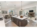 Modern kitchen features a large island, pendant lighting, and views into the living area at 515 Edmunds Ln # 38, Clover, SC 29710