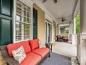 Inviting covered front porch with comfortable seating, perfect for relaxing outdoors at 9640 Alma Blount Blvd, Charlotte, NC 28277