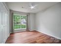 Bright bedroom with wood floors, large window, and ample natural light at 1863 New Castle Dr, Fort Mill, SC 29707