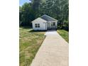 Charming home exterior with a welcoming front porch and well-manicured landscaping at 1889 Oak Hollow Rd, Gastonia, NC 28054