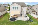 Outdoor patio with dining and lounge seating, perfect for entertaining in the backyard at 1988 Clear Brooke Dr, Kannapolis, NC 28083