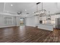 Open concept living space featuring tray ceilings, ceiling fan, and lots of natural light at 2081 Fordhill St, Rock Hill, SC 29732