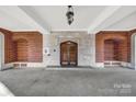Covered entrance with brick accents and elegant lighting, offering a grand welcome at 301 W 10Th St # 402, Charlotte, NC 28202