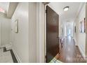 Hallway leading to unit 402, featuring hardwood floors and classic design at 301 W 10Th St # 402, Charlotte, NC 28202