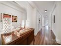 Hallway with hardwood floors, decorative accents, and ample natural light at 301 W 10Th St # 402, Charlotte, NC 28202