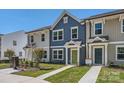 Beautiful new townhome exterior with colorful siding and a well-manicured lawn at 3015 Howell Mill Rd, Charlotte, NC 28208