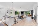Bright, open floor plan with large windows, sleek finishes, and modern decor at 302 Wesley Heights Way, Charlotte, NC 28208