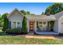 Close up view of the front porch, showing the front door and seating area at 308 Southland Rd, Huntersville, NC 28078