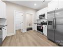 Modern kitchen with stainless steel appliances, sleek countertops, and ample cabinet space at 503 Eddleman Rd, Kannapolis, NC 28083