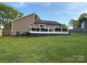 View of a large deck in a spacious backyard, perfect for outdoor entertaining at 5050 Forest Ridge Dr, Hickory, NC 28602