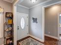 Bright foyer features wood floors, decorative rug, and ample space, creating a welcoming entrance at 604 Airport Rd, Kannapolis, NC 28081