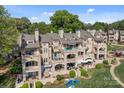 Beautiful townhome with manicured grounds, multiple patios, and serene views for upscale living at 657 Portside Dr, Davidson, NC 28036