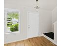 Inviting foyer with hardwood floors, natural light, and a view to the outdoors at 6647 Vlosi Dr, Charlotte, NC 28226