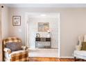Hallway features console table, mirror and attractive wall paper at 6718 Summerlin Pl, Charlotte, NC 28226