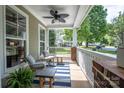Relaxing front porch features comfortable seating, a stylish rug, and views of the neighborhood at 7409 Gilderstern Glen Ct, Huntersville, NC 28078