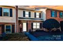 Charming two-story brick townhome with black shutters and manicured landscaping at 825 21St Ne Ave, Hickory, NC 28601