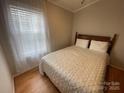 Cozy bedroom featuring a comfortable bed with soft bedding and bright natural light from a window at 116 Dove Ln, New London, NC 28127