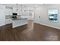 Spacious living area with hardwood floors, with natural light and an open concept at 11933 Silverheel Ln, Huntersville, NC 28078