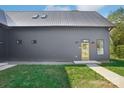 Beautifully designed home with metal roof, modern door, and well-maintained lawn at 122 Laura Rd # A, Mooresville, NC 28117