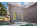 Modern home featuring a glass front door with sidelight window and minimalist landscaping at 122 Laura Rd # B, Mooresville, NC 28117