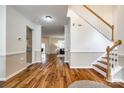 Open-concept foyer with hardwood floors leading to the kitchen and living areas at 1418 Lonan Dr, Waxhaw, NC 28173