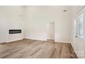 Bright living room with an electric fireplace and high ceilings at 205 Sheffield Dr, York, SC 29745
