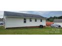 Home exterior with white siding, an AC unit, and a grassy yard at 2109 Boggs St, Lincolnton, NC 28092