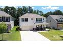 This two-story home has white siding, blue shutters and features a well-manicured front yard at 2220 Sussex Rd, York, SC 29745
