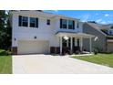 A two-story home showcases its attached garage, white siding, and well-maintained lawn at 2220 Sussex Rd, York, SC 29745
