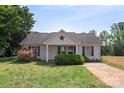 Charming single-story home with well-maintained lawn and landscaping, including flowering shrubs at 244 Whitesides Rd, Bessemer City, NC 28016