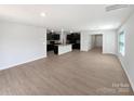 Open floor plan with hardwood floors, a kitchen, and a bright, spacious feel at 250 Marinna Joy Cir, Rockwell, NC 28138